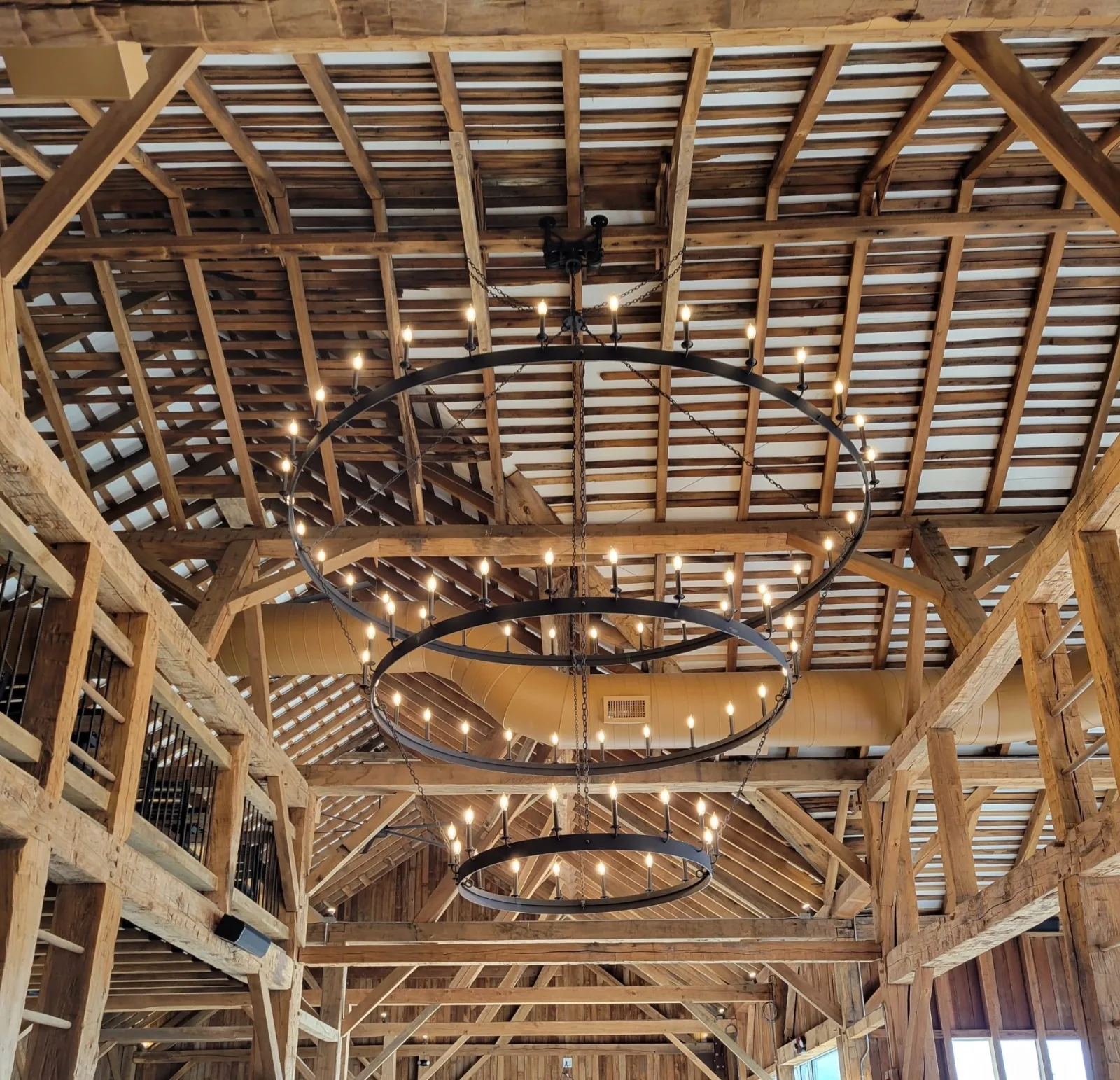 The signature triple iron-ring chandelier of The Barn