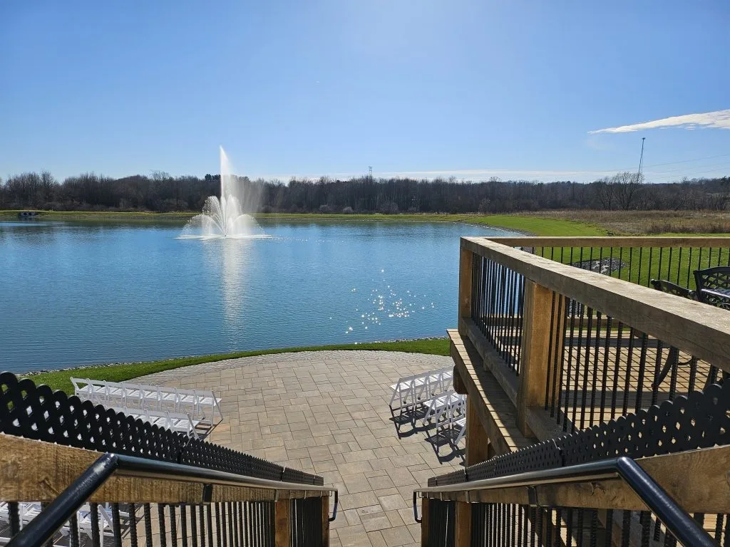 The four-acre lake and autumn tree line